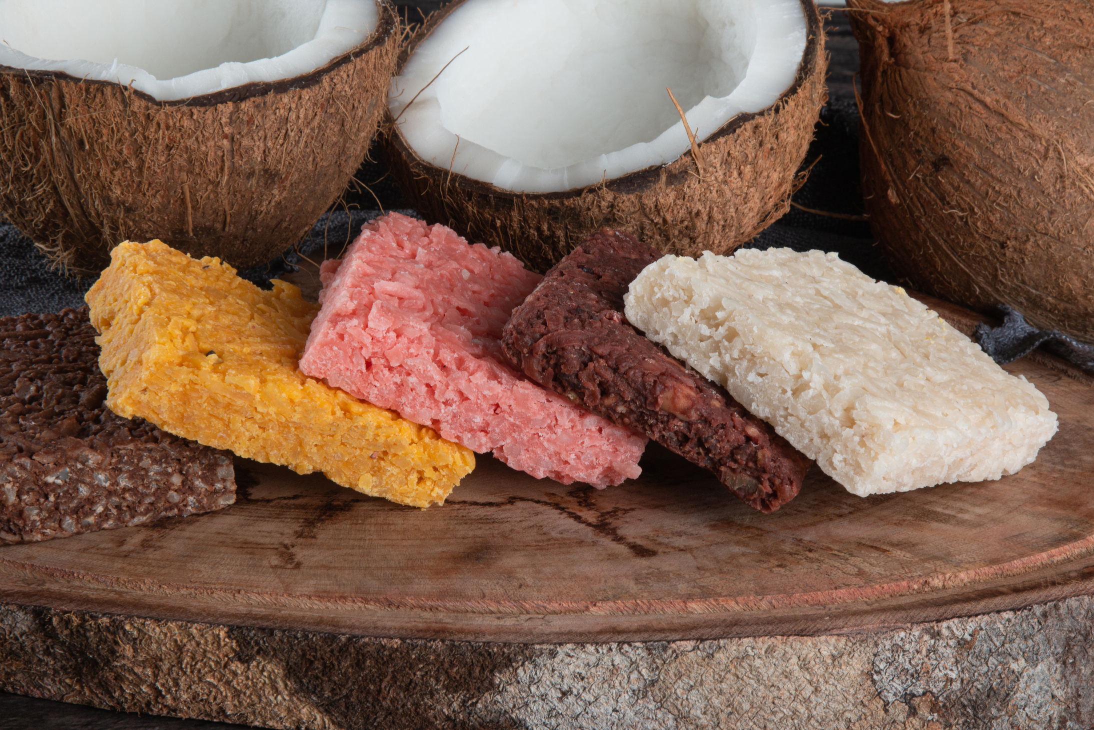 Cocada coconut candy, sweet Brazilian in rustic wood background